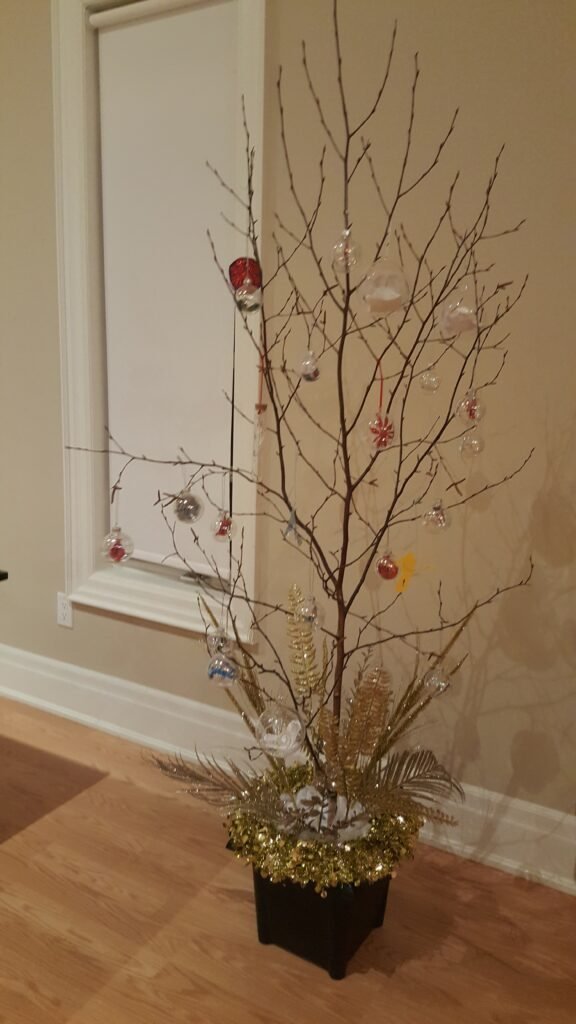 Christmas tree decorated with handmade community ornaments created during the Arts King Society workshop I facilitated.